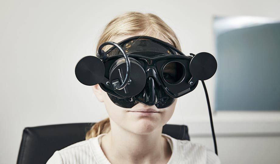 Young girl wearing small face goggle for pediatrics
