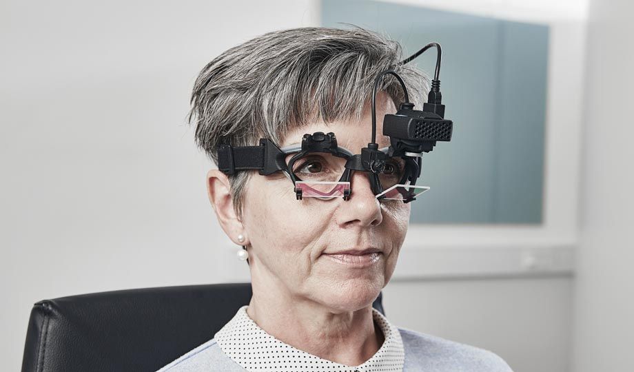 Woman wearing EyeSeeCam vHIT goggle