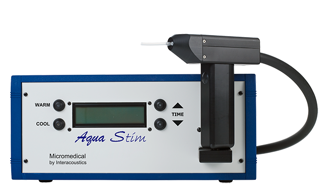 The device consists of a black irrigator, shaped similar to a drill with a small tube at the end. The irrigator is connected by a thick black tube to the main unit, which is rectangular shaped. The edge of the main unit’s blue, while the front panel is grey. Beside a small digital display, there are buttons to choose either warm or cool, and to increase or decrease the time.