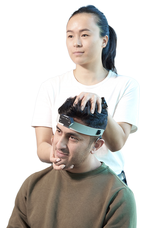 A clinician is performing head impulses on the patient in the LARP plane.
