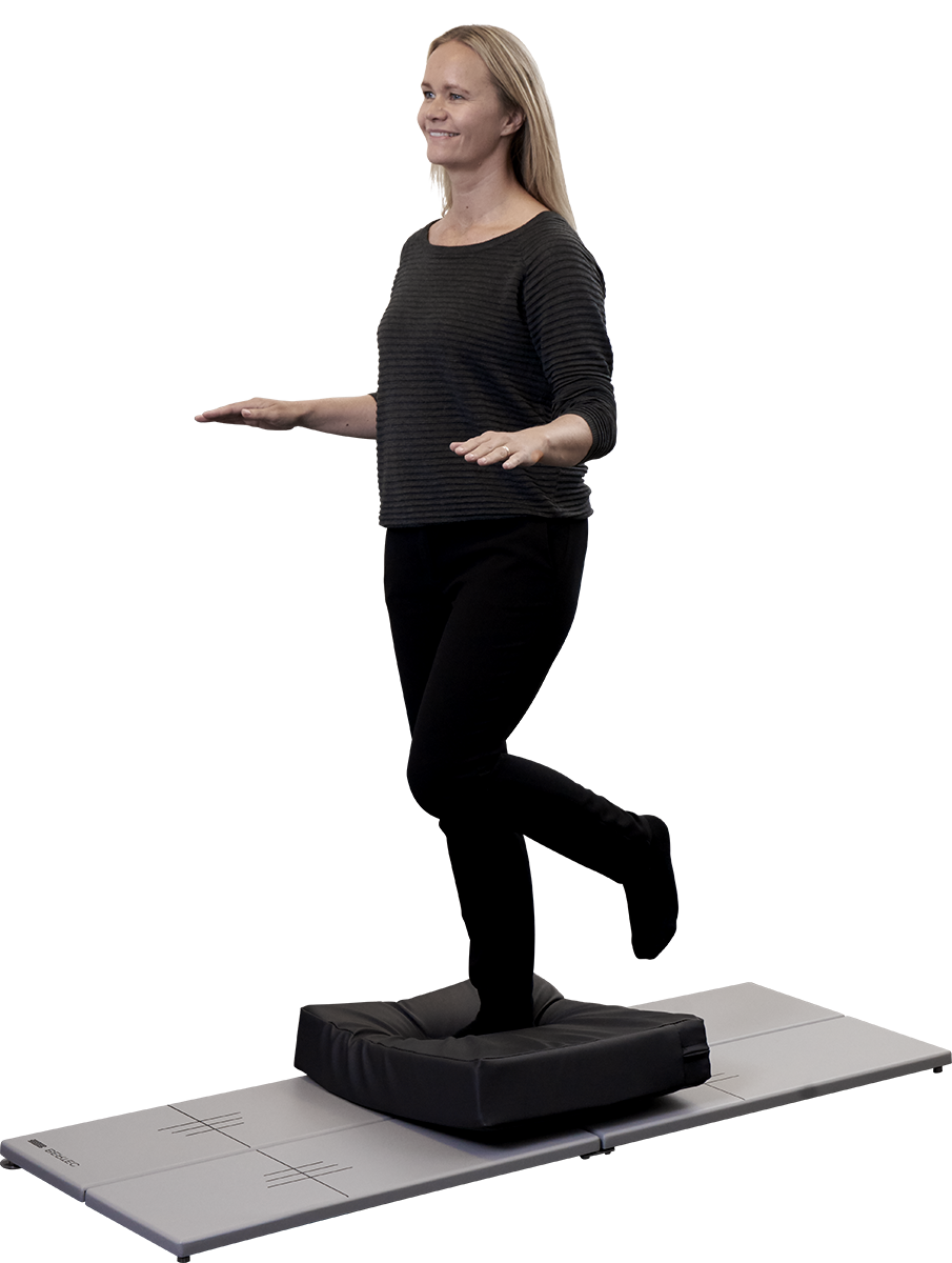 Woman standing on a foam surface placed on top of a long force plate.