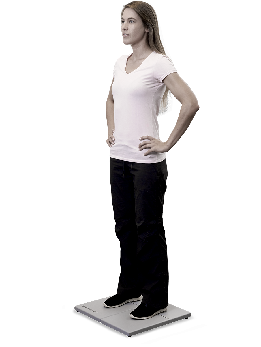 Young woman standing on small and firm force plate.