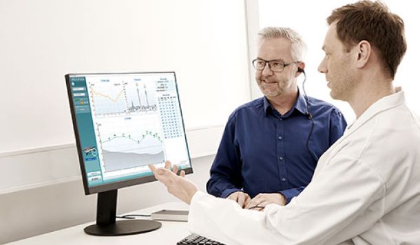 Male clinician performing DPOAE testing on male patient