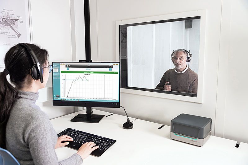 Clinician performing ACT test on laptop