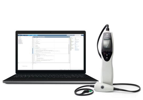 A computer with a device on it