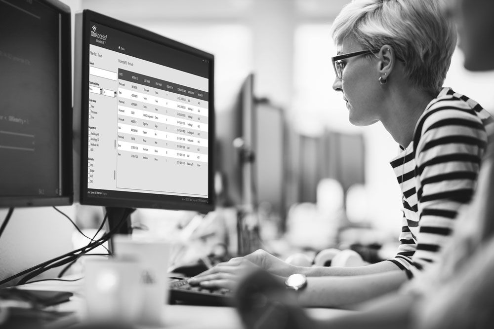 Woman looking at computer screen.