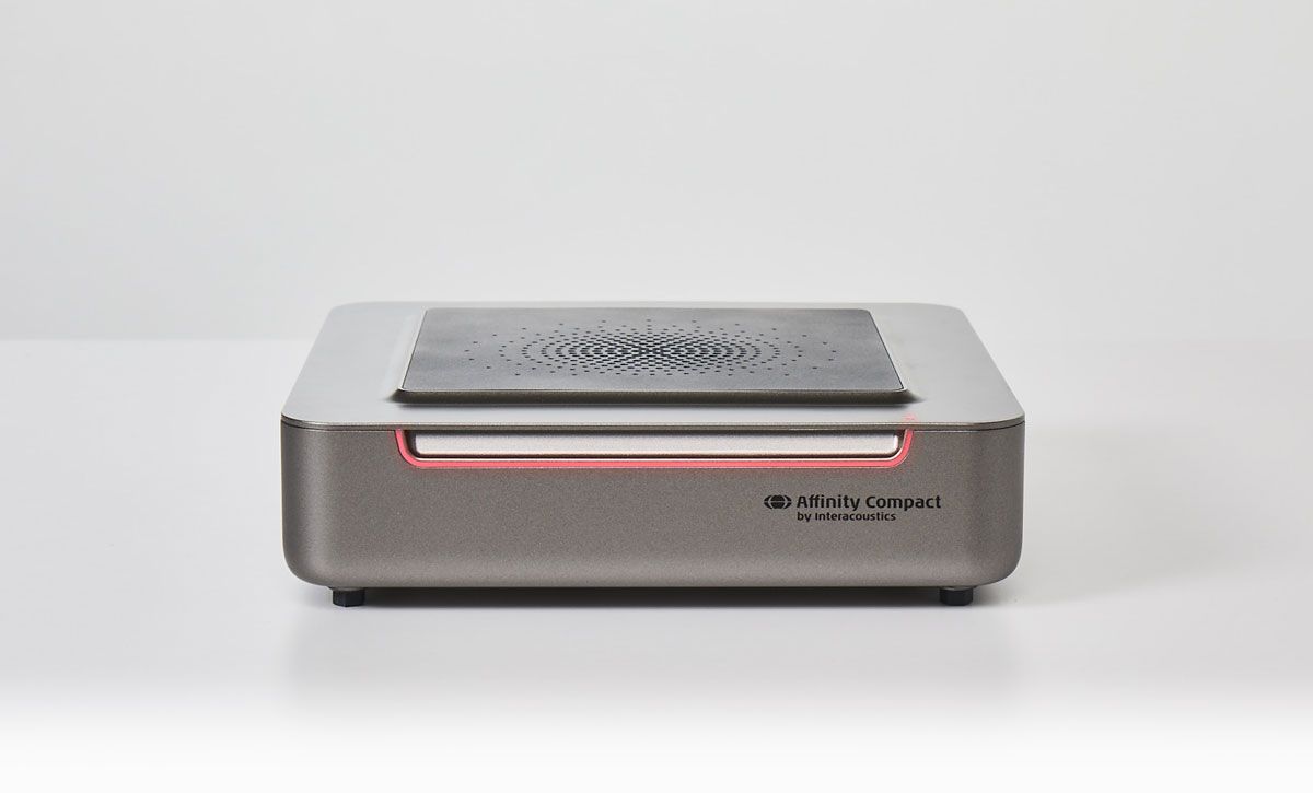 Version two of Affinity Compact. Speaker on its base. Red light on the front of the unit.