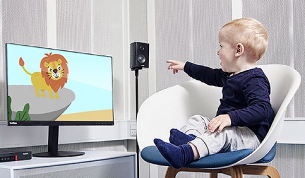 Little boy pointing at computer screen with animated lion