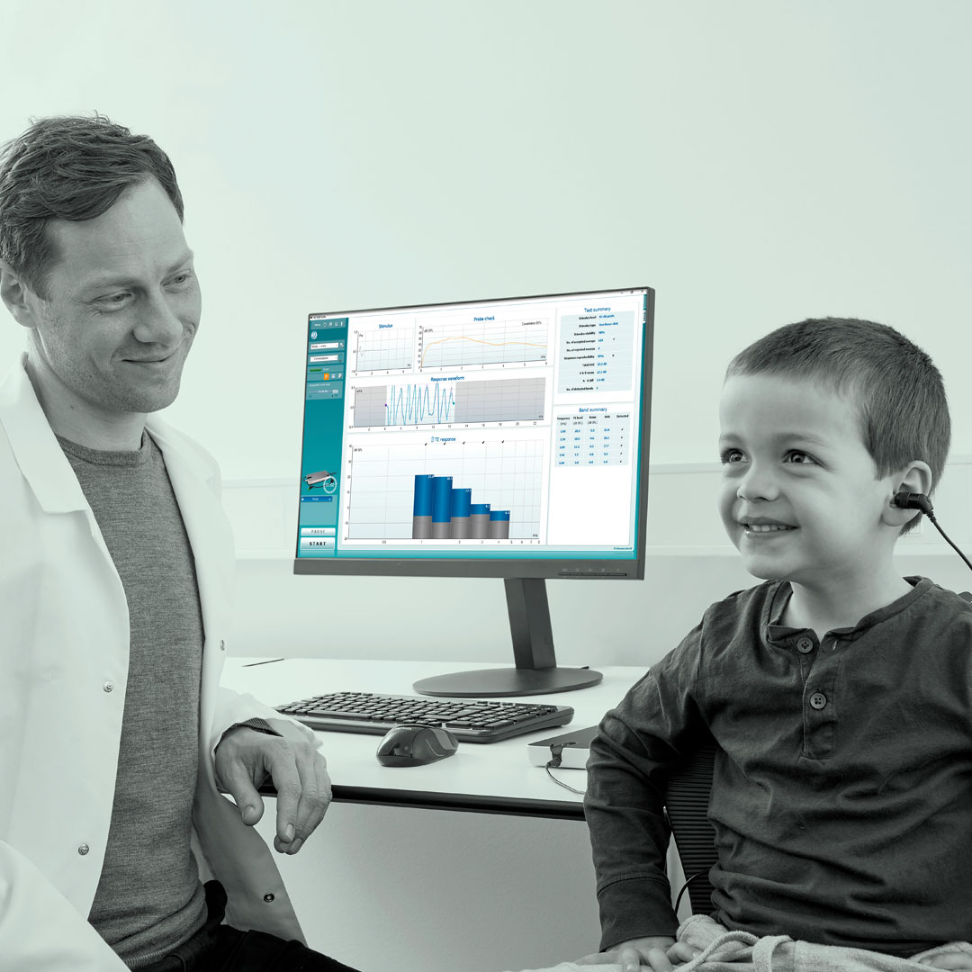 Male clinician performing TEOAE in young boy