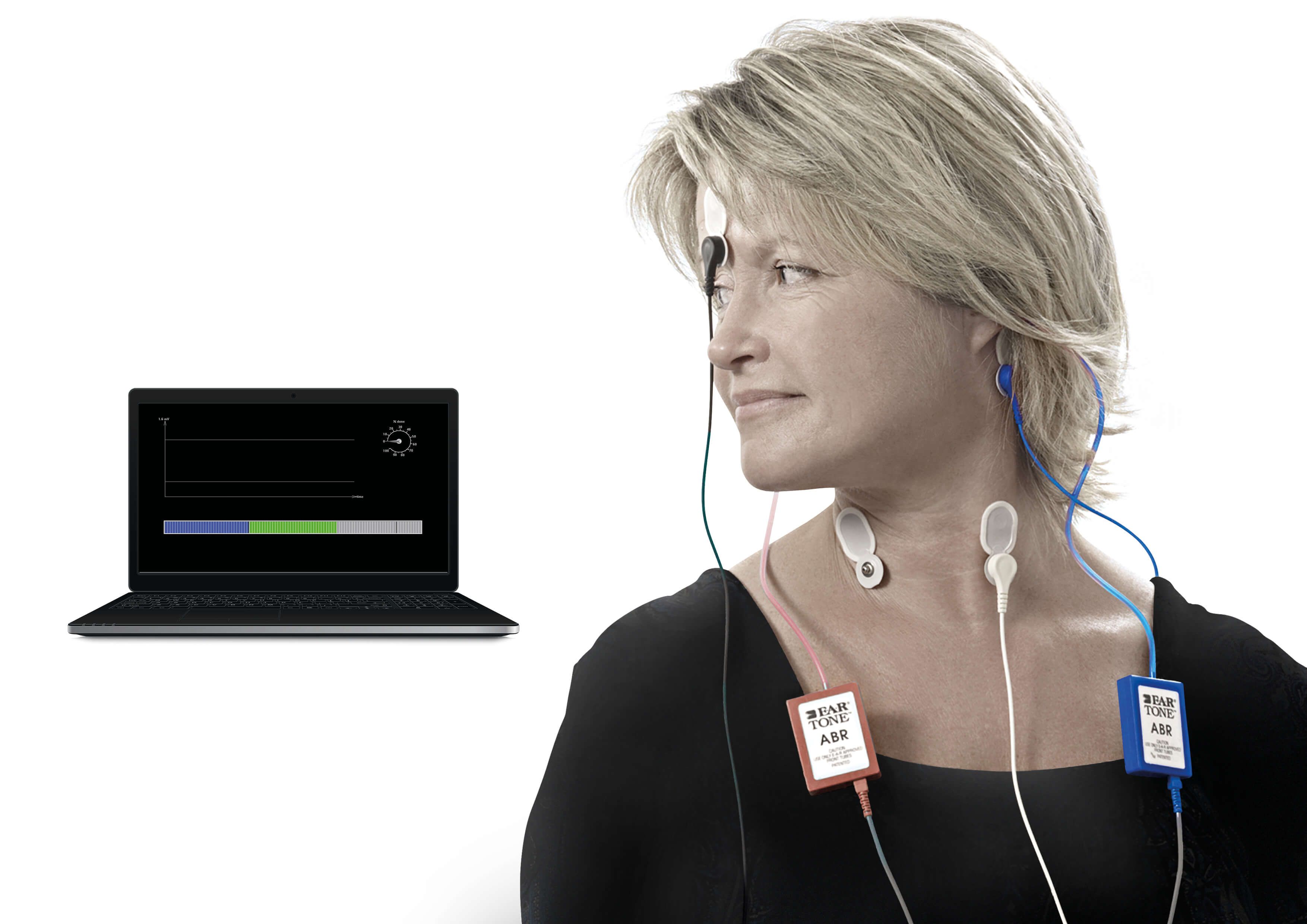 Female patient fitted with electrodes for VEMP testing